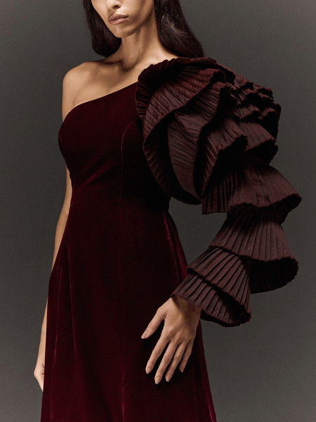 MAROON VELVET PANELLED FLARED ONE SHOULDER DRESS WITH RUFFLED SLEEVES