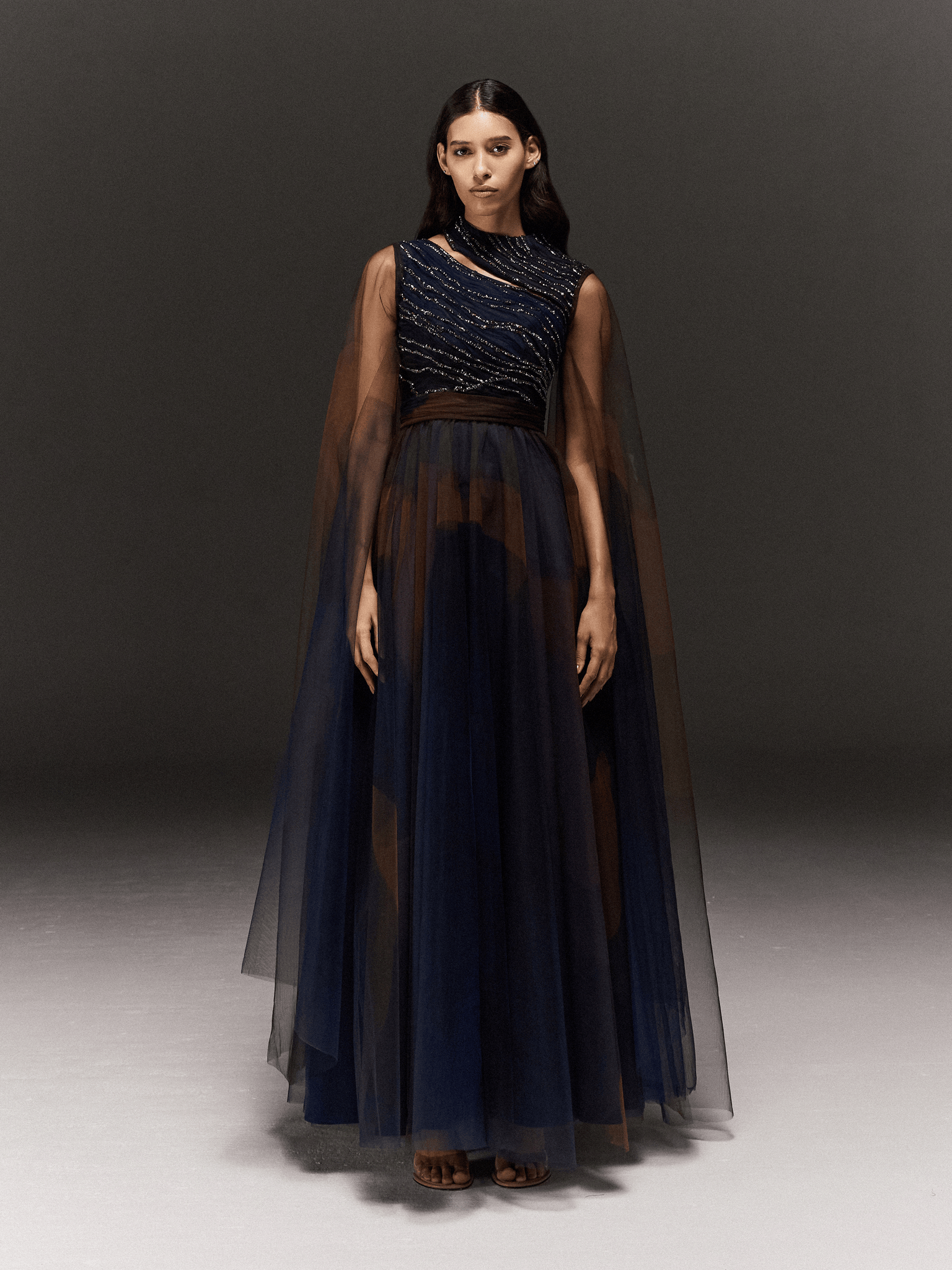 BLUE AND BROWN PRINTED AND HAND EMBROIDERED DRAPED AND FLARED DRESS WITH SLEEVE TRAILS