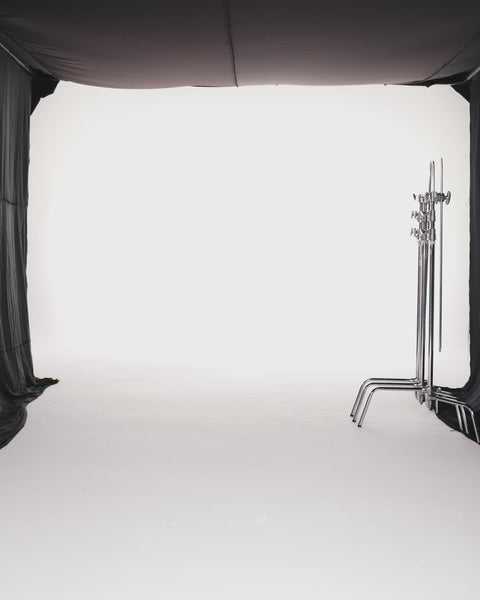 PLEATED METALLIC CREPE PANELLED DRESS WITH CAPE