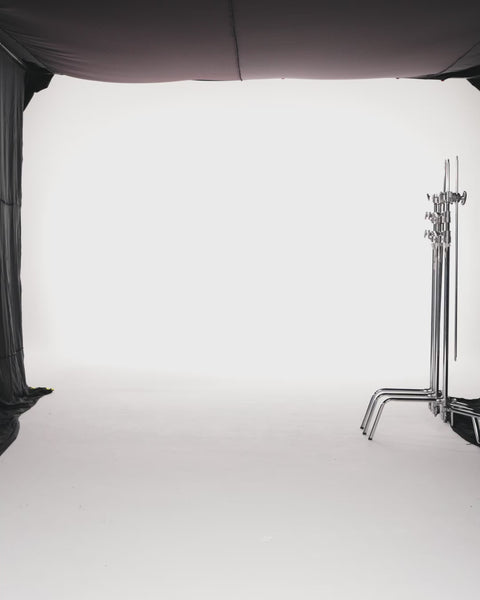 BLACK TUBE FLARED DRESS WITH EXAGGERATED SLEEVE CAPE