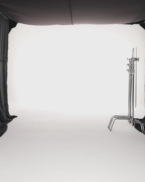 PLEATED METALLIC CREPE PANELLED DRESS WITH CAPE